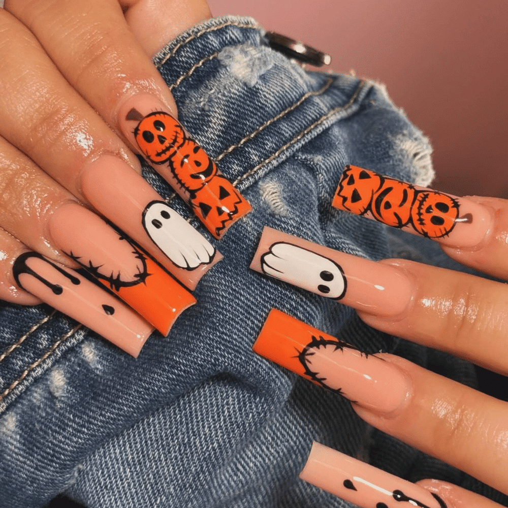 Close-up of Halloween-themed nails with detailed designs like Jack-o'-Lantern Faces: From Cute to Creepy