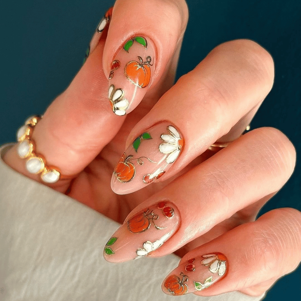 Close-up of Halloween-themed nails with detailed designs like Textured Pumpkin Nails