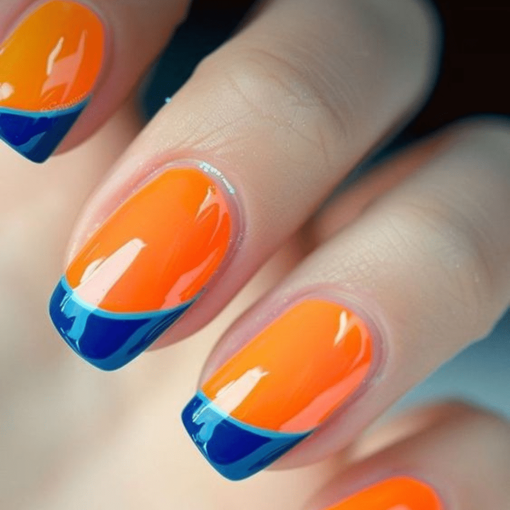 Close up of nails with glittery orange nails having Orange and Navy Contrast