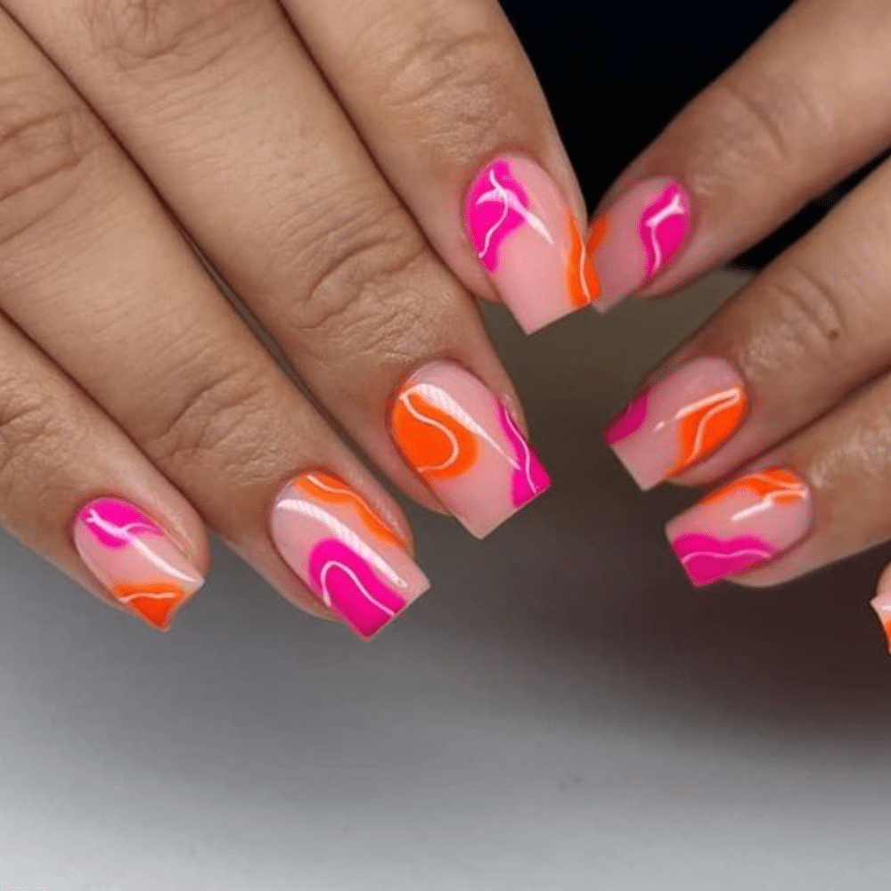 Close up of nails with glittery orange nails having Orange and Pink Color Block