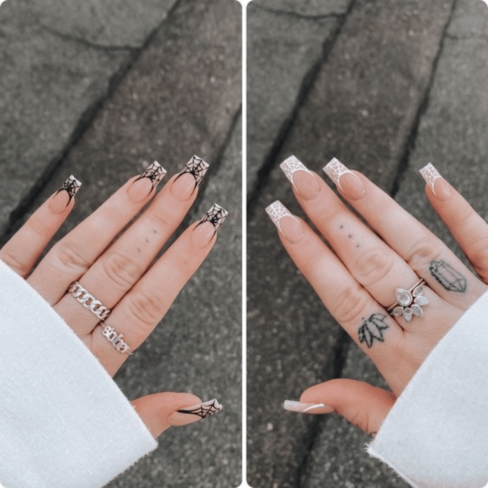 Close-up of Halloween-themed nails with detailed designs like Spider Web French Tips