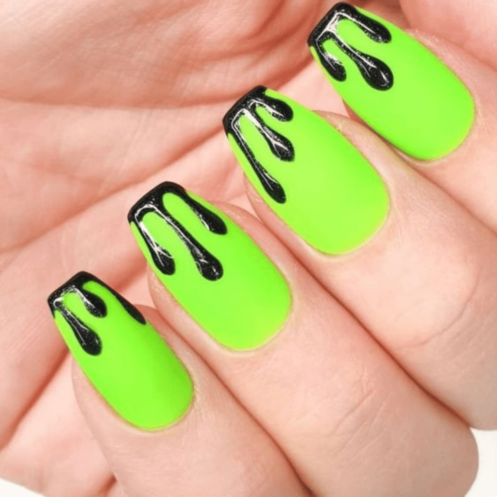 Close-up of Halloween-themed nails with detailed designs like Glow-in-the-Dark Slime Drips