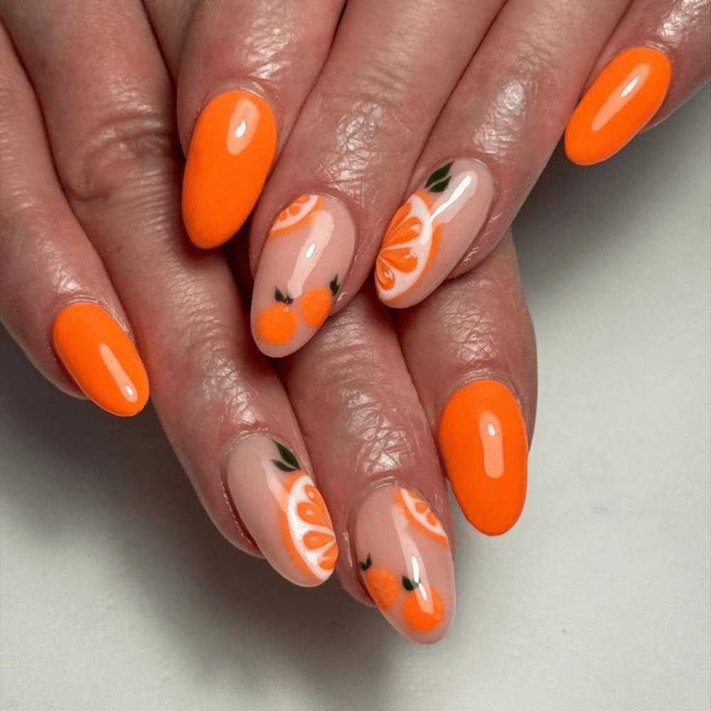 Close up of nails with glittery orange nails having Negative Space with Orange