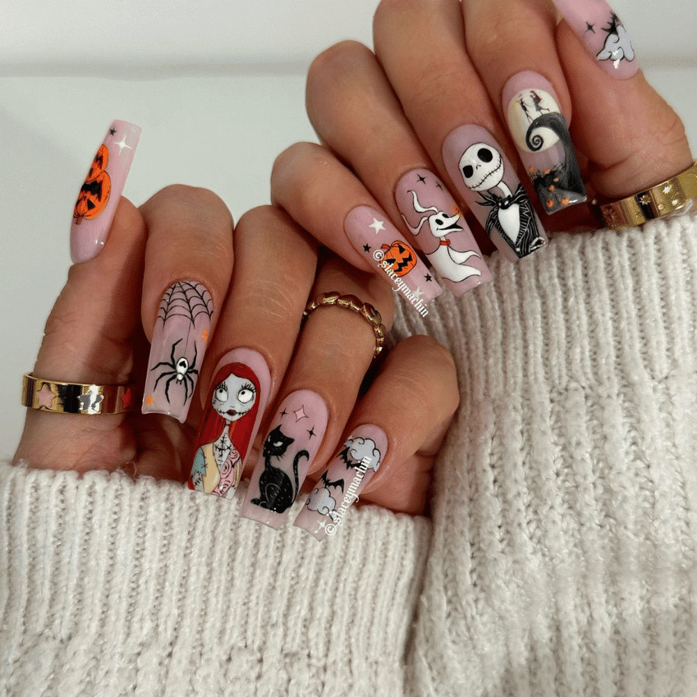 Close-up of Halloween-themed nails with detailed designs like "The Nightmare Before Christmas" Characters