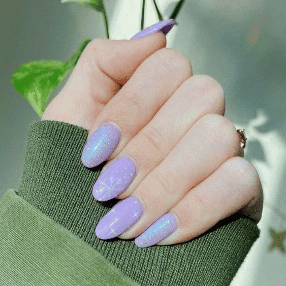 Close-up of hands having lavender nails with Winter Wonderland