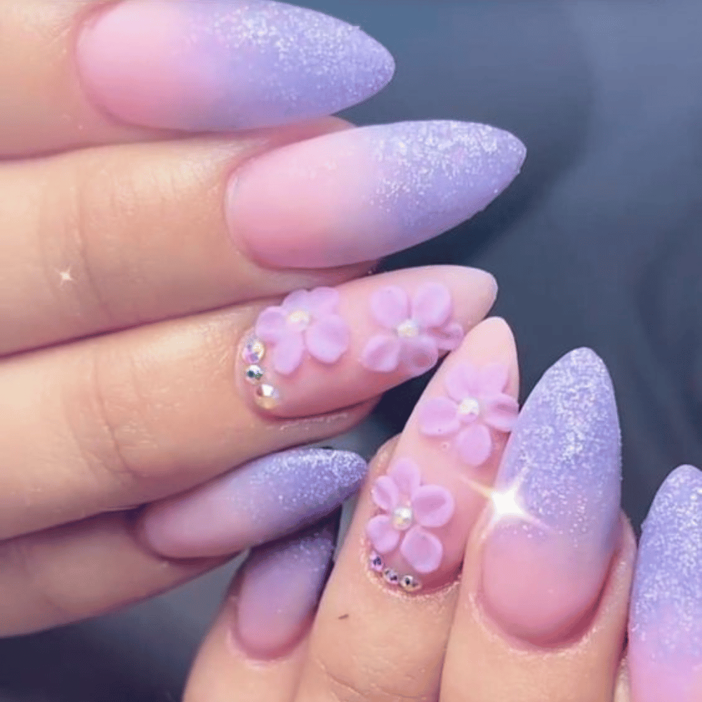 Close-up of hands having lavender nails with 3D Elements