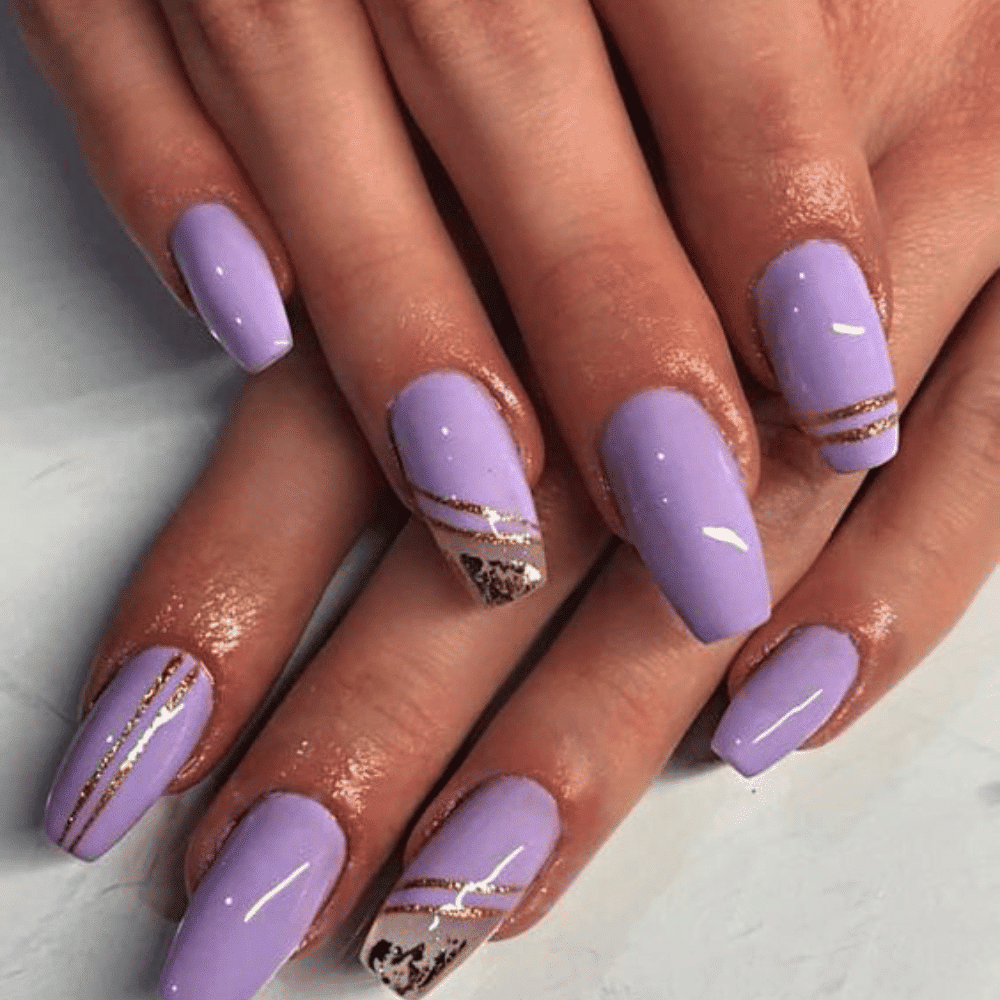 Close-up of hands having lavender nails with Gold Pairing