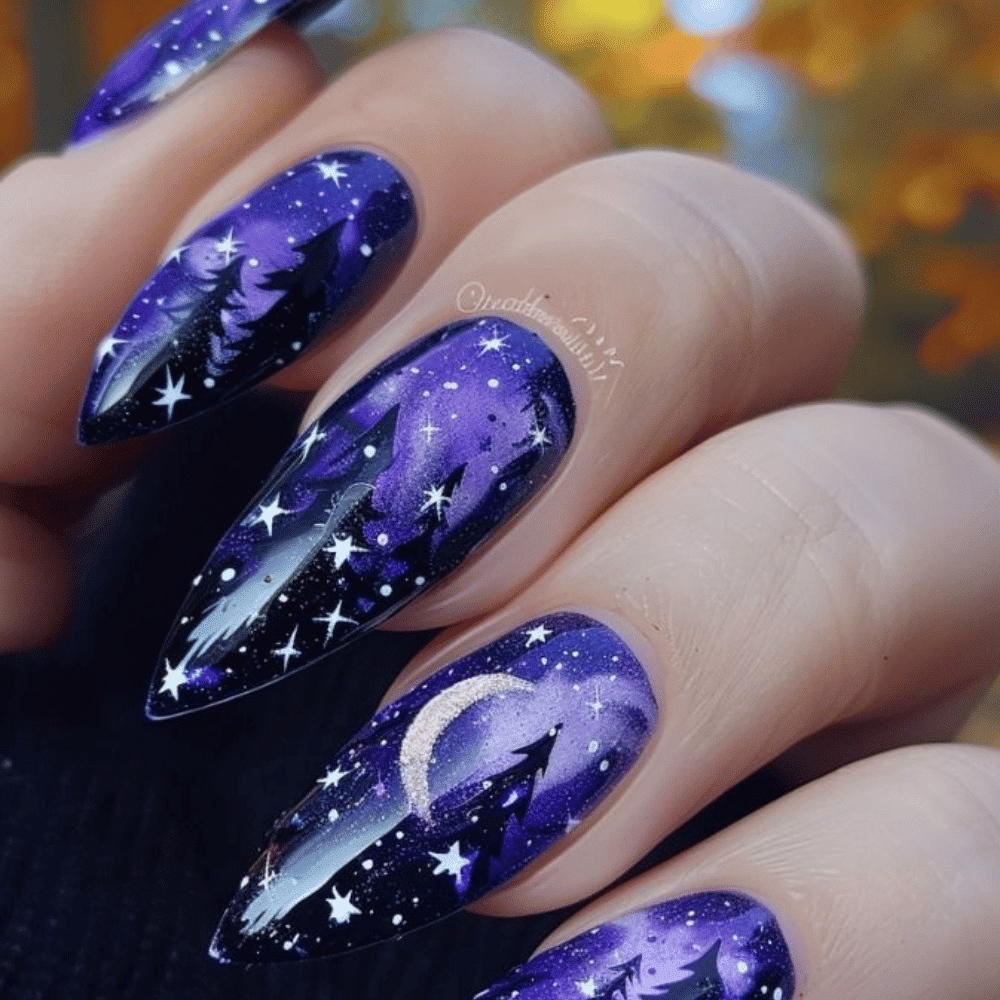 Close-up of Halloween-themed nails with detailed designs like Mystical Moon Phases