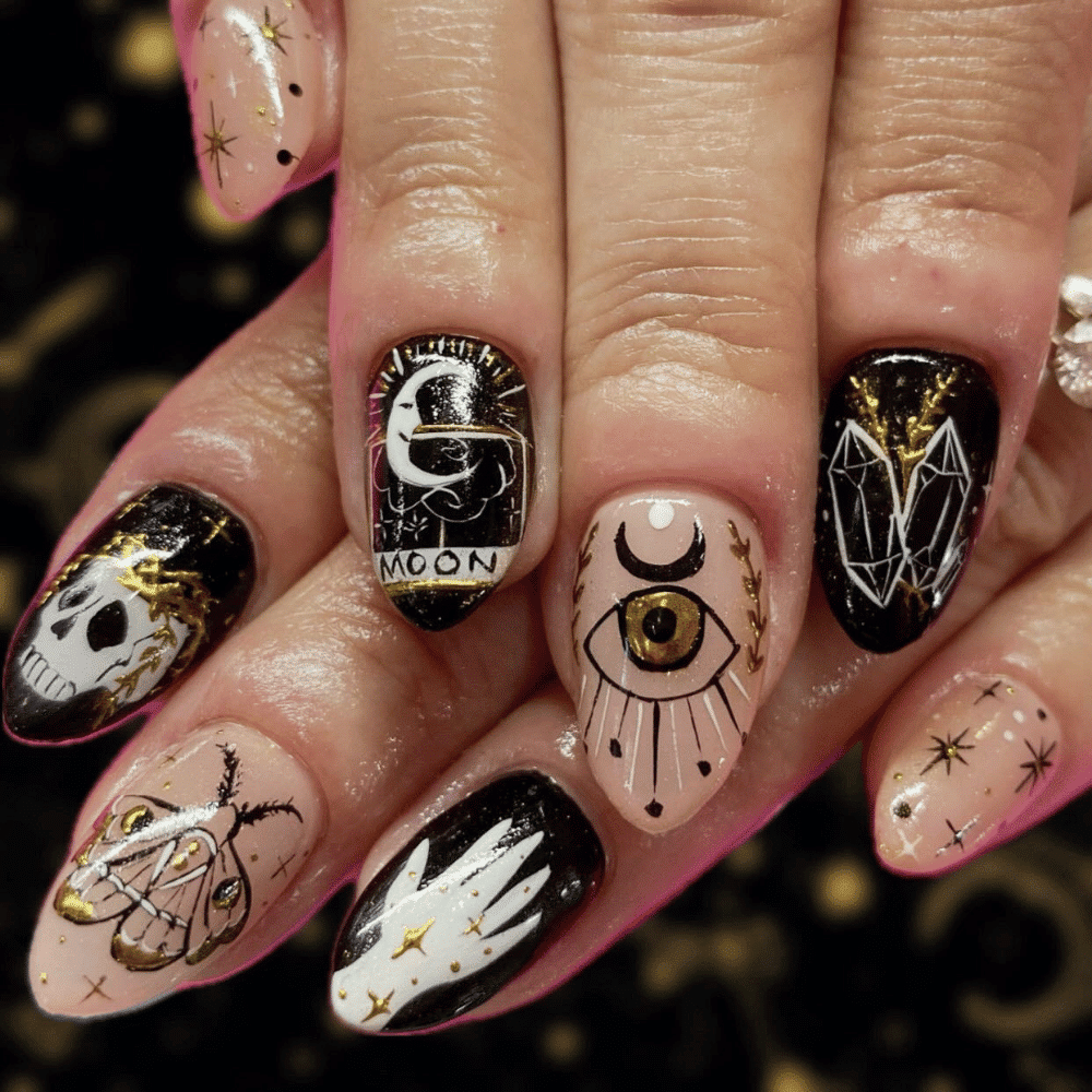 Close-up of Halloween-themed nails with detailed designs like Crystal Ball and Tarot Card Designs