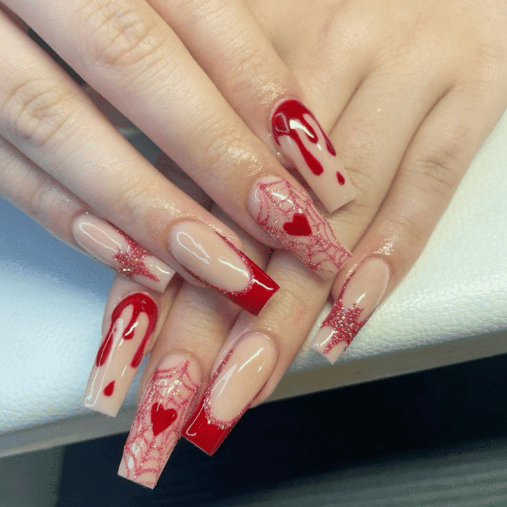 Close-up of Halloween-themed nails with detailed designs like Dripping Blood Effect