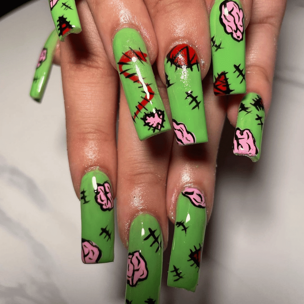 Close-up of Halloween-themed nails with detailed designs like Zombie-Inspired Decay Designs