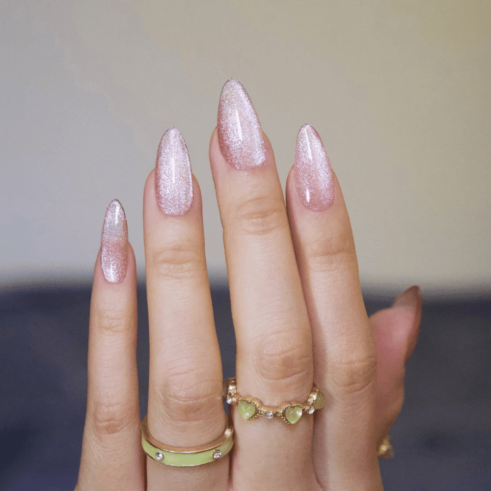 Hand with Pink Nails having Magnetic Allure