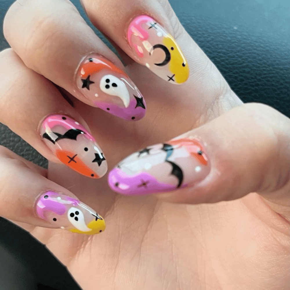 Close-up of Halloween-themed nails with detailed designs like Pastel Ghost Parade