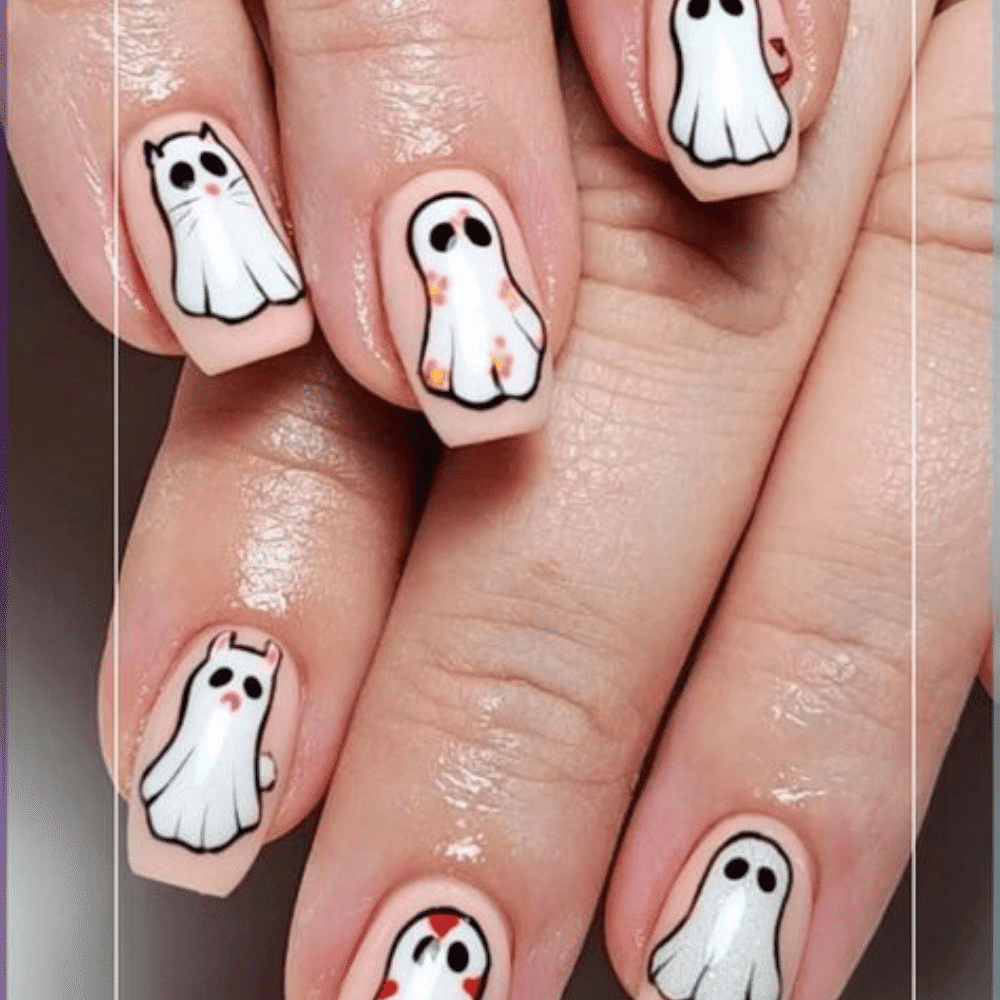 Close-up of Halloween-themed nails with detailed designs like Floating Ghosts on Clear Base