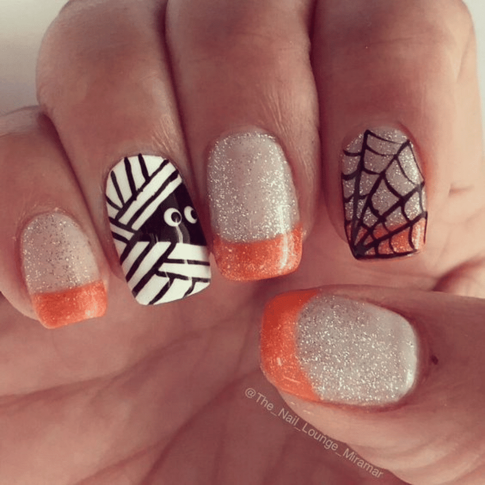 Close-up of Halloween-themed nails with detailed designs like Peek-a-Boo Monster Eyes