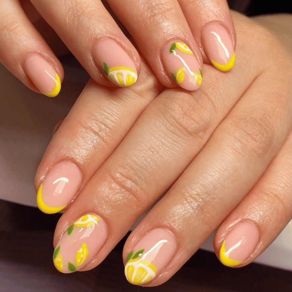 A close-up of a woman's hands showcasing vibrant yellow and lemon-colored nails, elegantly manicured and well-groomed.