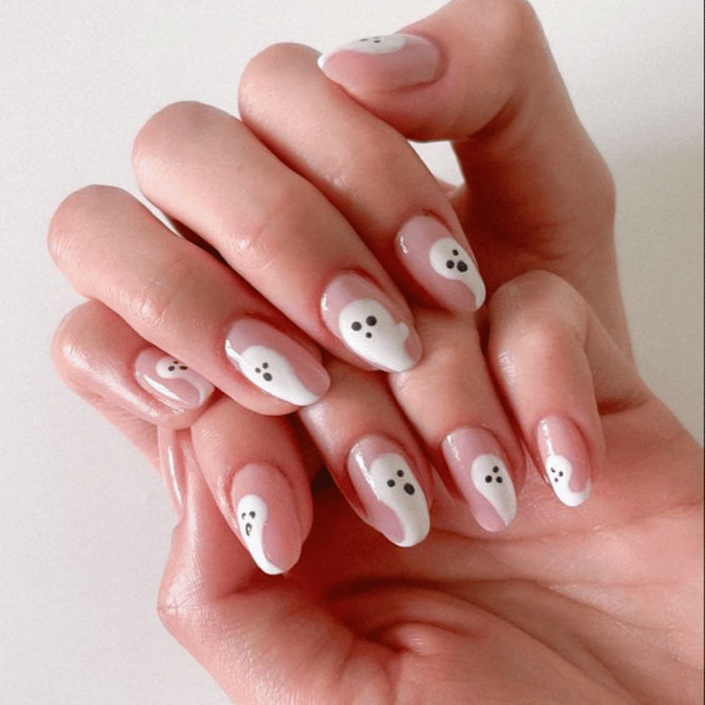 Close-up of Halloween-themed nails with detailed designs like Translucent Ghost Tips