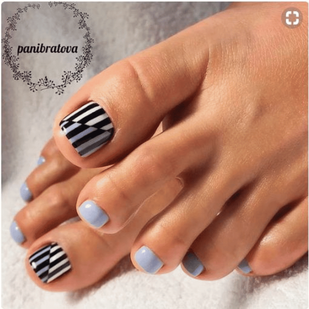 Close-up of toes with optical illusion toe nail