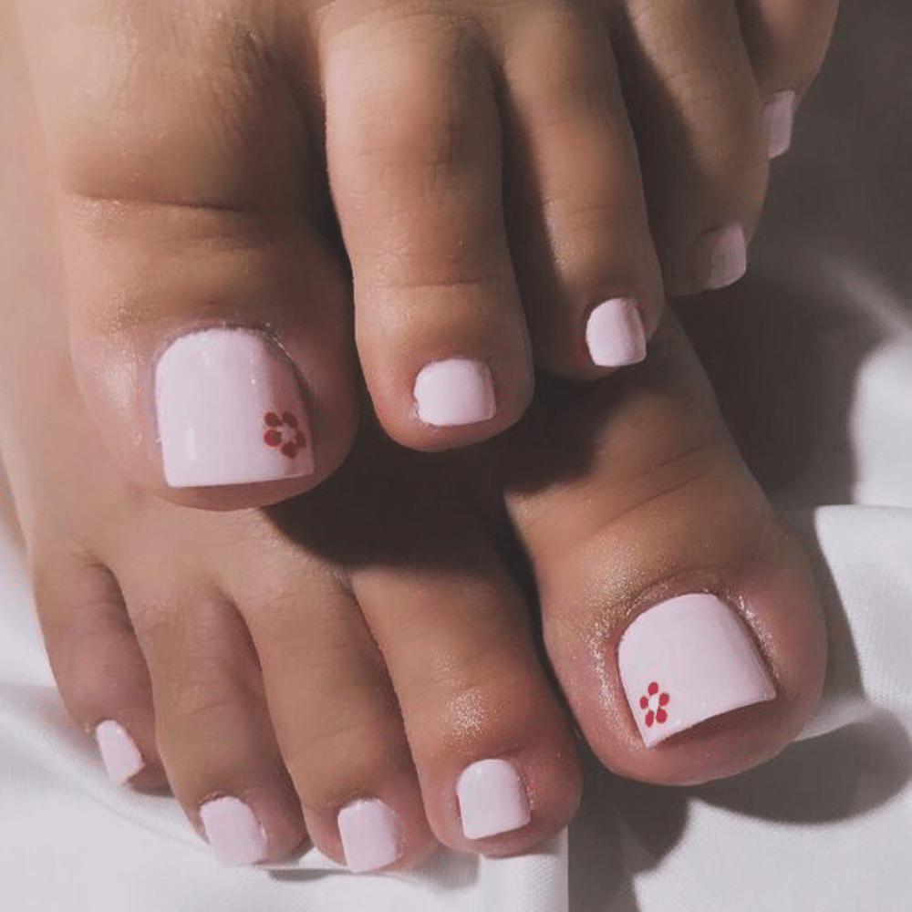 Close-up of toes with Tiny Tattoos toe nail