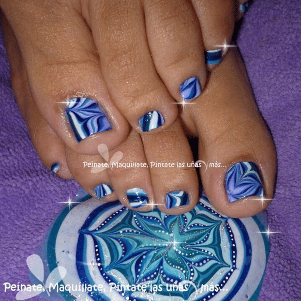 Close-up of toes with Watermarble Magic toe nail