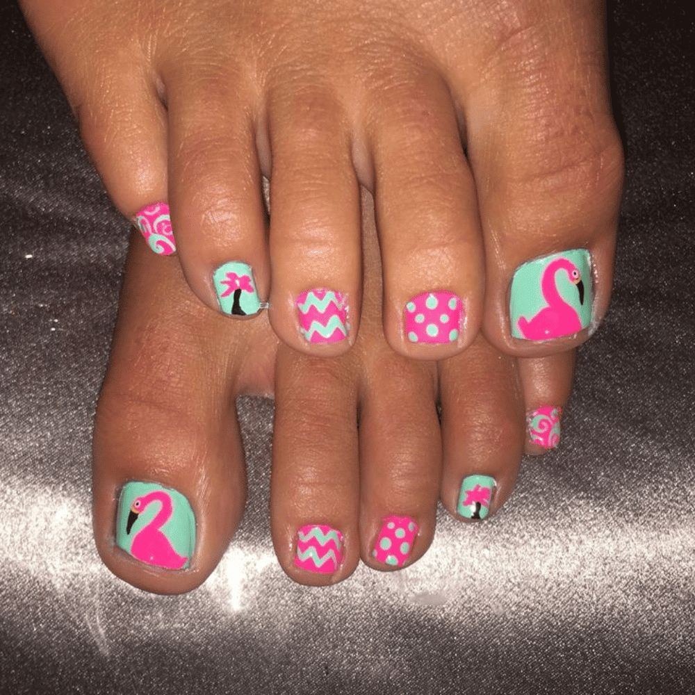 Close-up of toes with flamingo styled designs