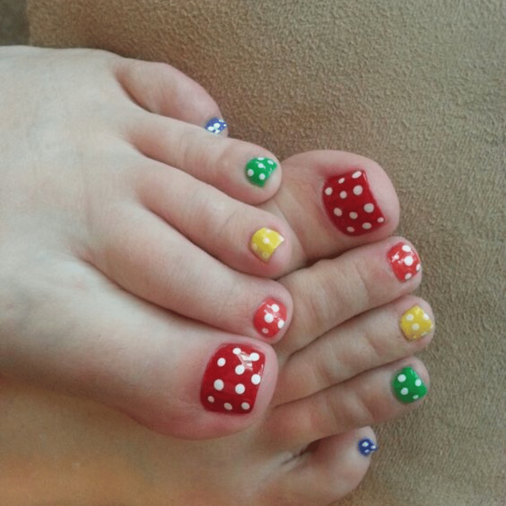 Close-up of toes with Dotting Tool Designs toe nail