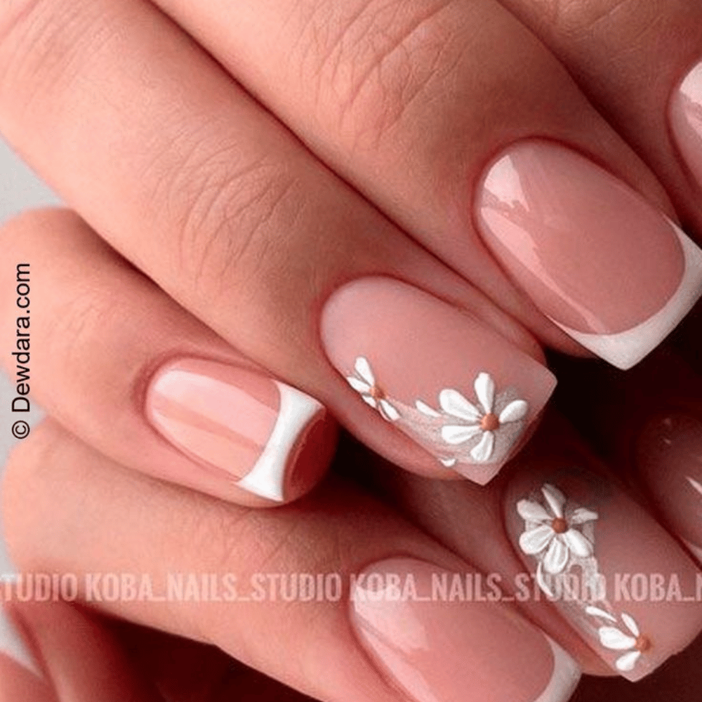 A collection of intricate nail art designs featuring vibrant floral patterns and delicate details on each nail.