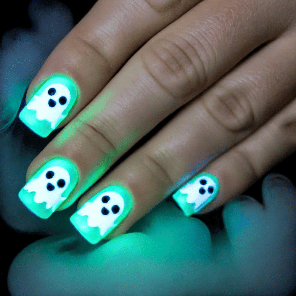 Close-up of Halloween-themed nails with detailed designs like Glow-in-the-Dark Phantom Faces