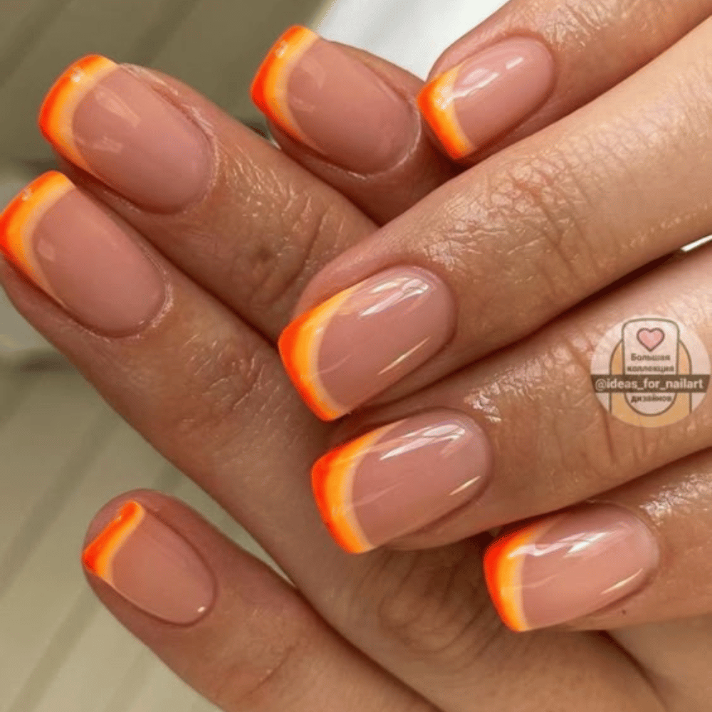 Close-up of hands with fall nail design having Double French with Complementary Fall Shades