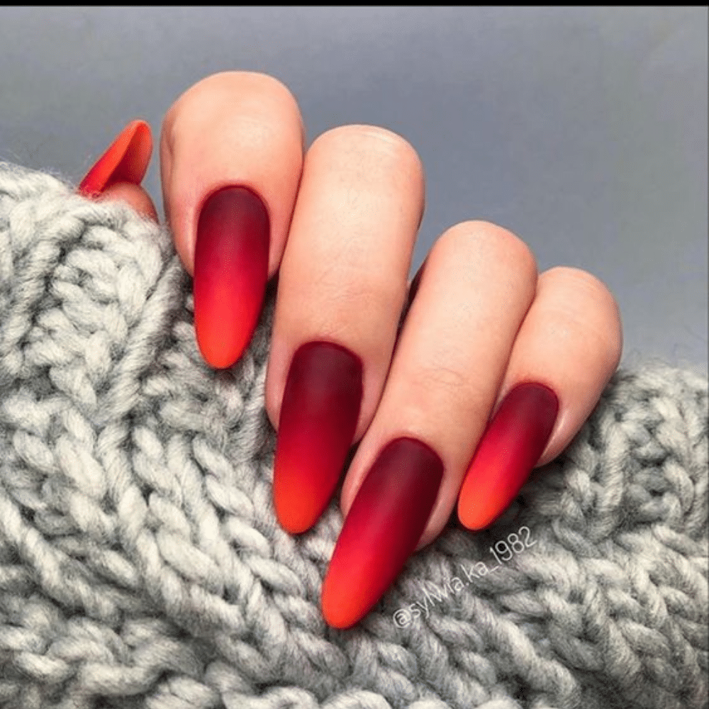 Close up of nails with glittery orange nails having Red to Orange Gradient