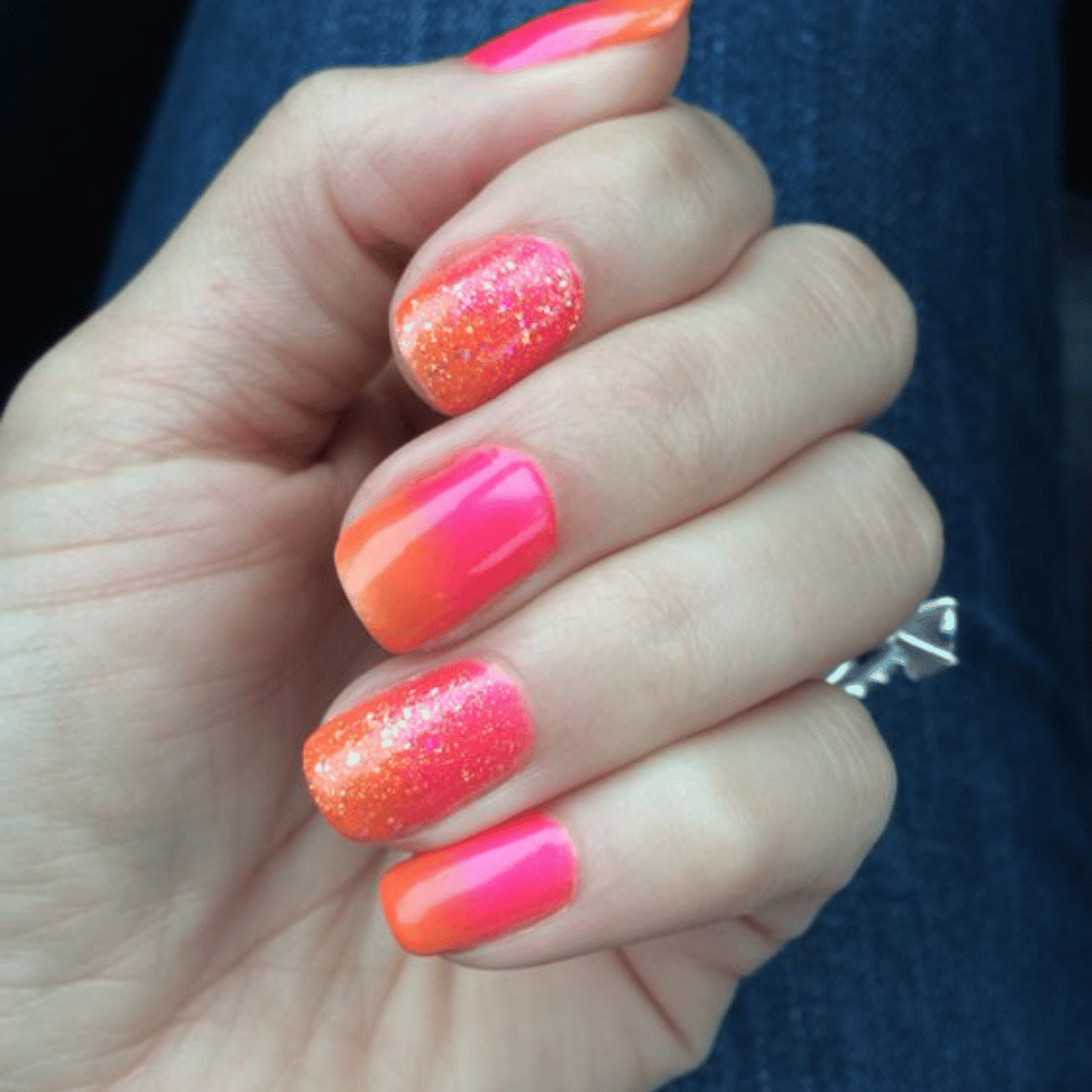 Hand with Pink Nails having Sunset Sparkle