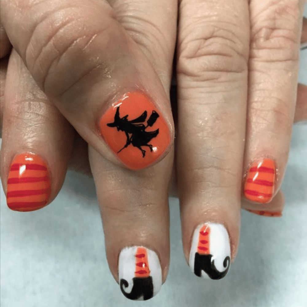 Close-up of Halloween-themed nails with detailed designs like Witch Hat and Broom Designs