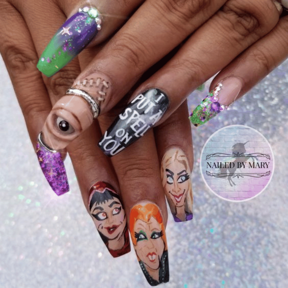 Close-up of Halloween-themed nails with detailed designs like Spell Book Inspired Patterns