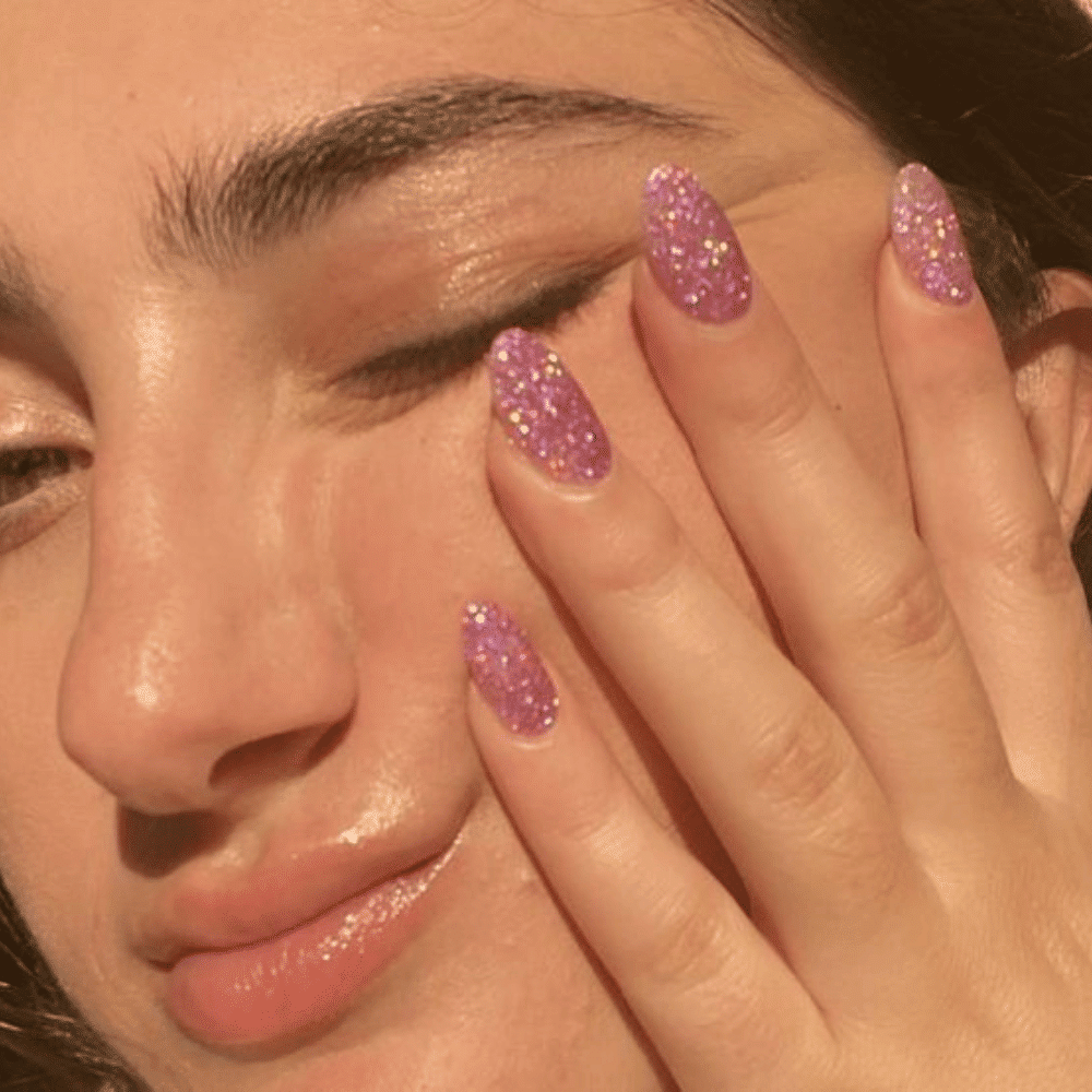 Hand with Pink Nails having Galaxy Nails