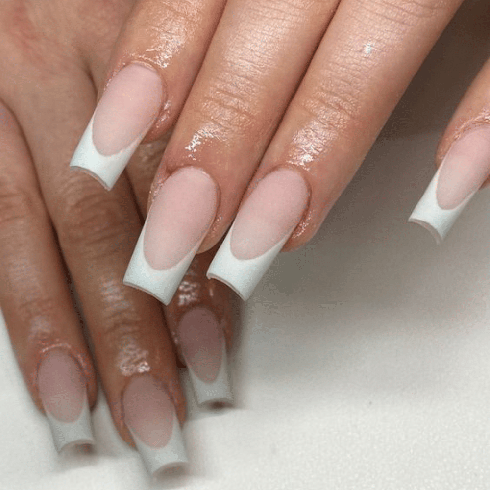 Close-up of a hand with white French tip Matte Magic nail