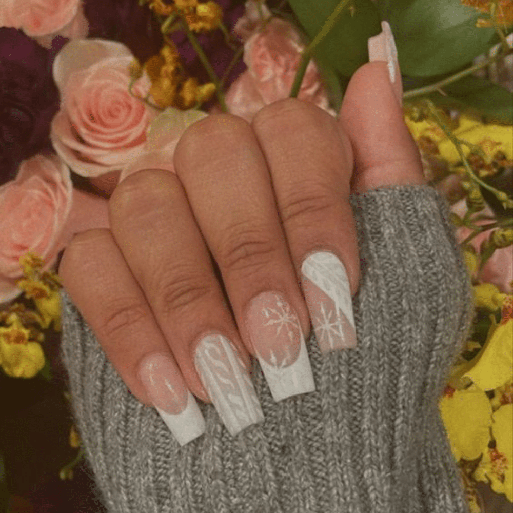 Close-up of a hand with white French tip Knitted Cozy nail