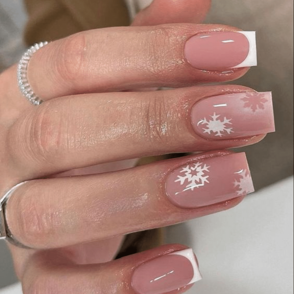 Close-up of a hand with white French tip Winter Frost nail