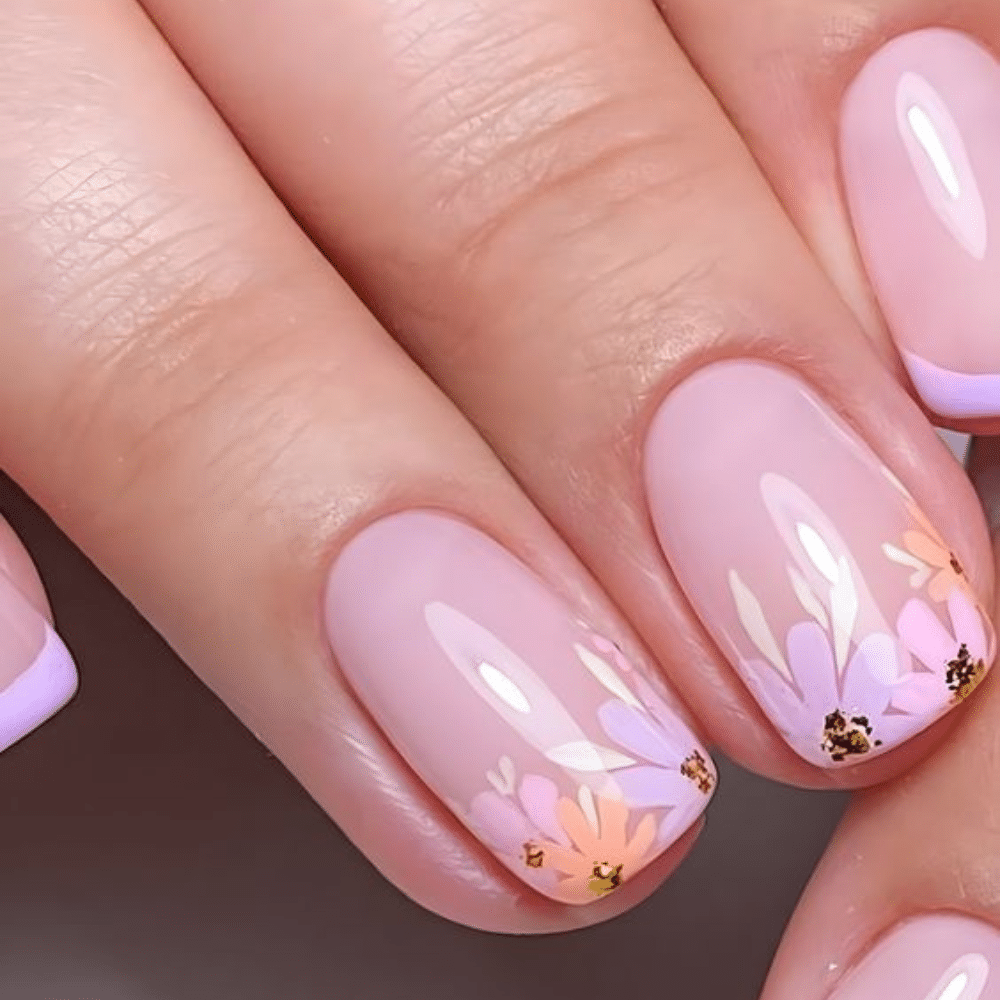 Close-up of a hand with white French tip nail  with floral fusion