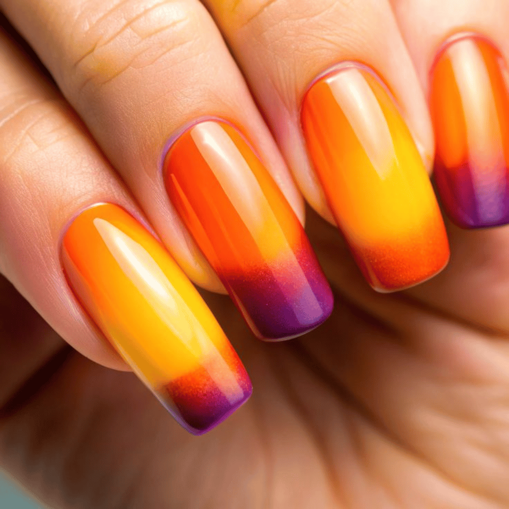 Close-up of hands with fall nail design having Warm-to-Cool Fall Color Shifts